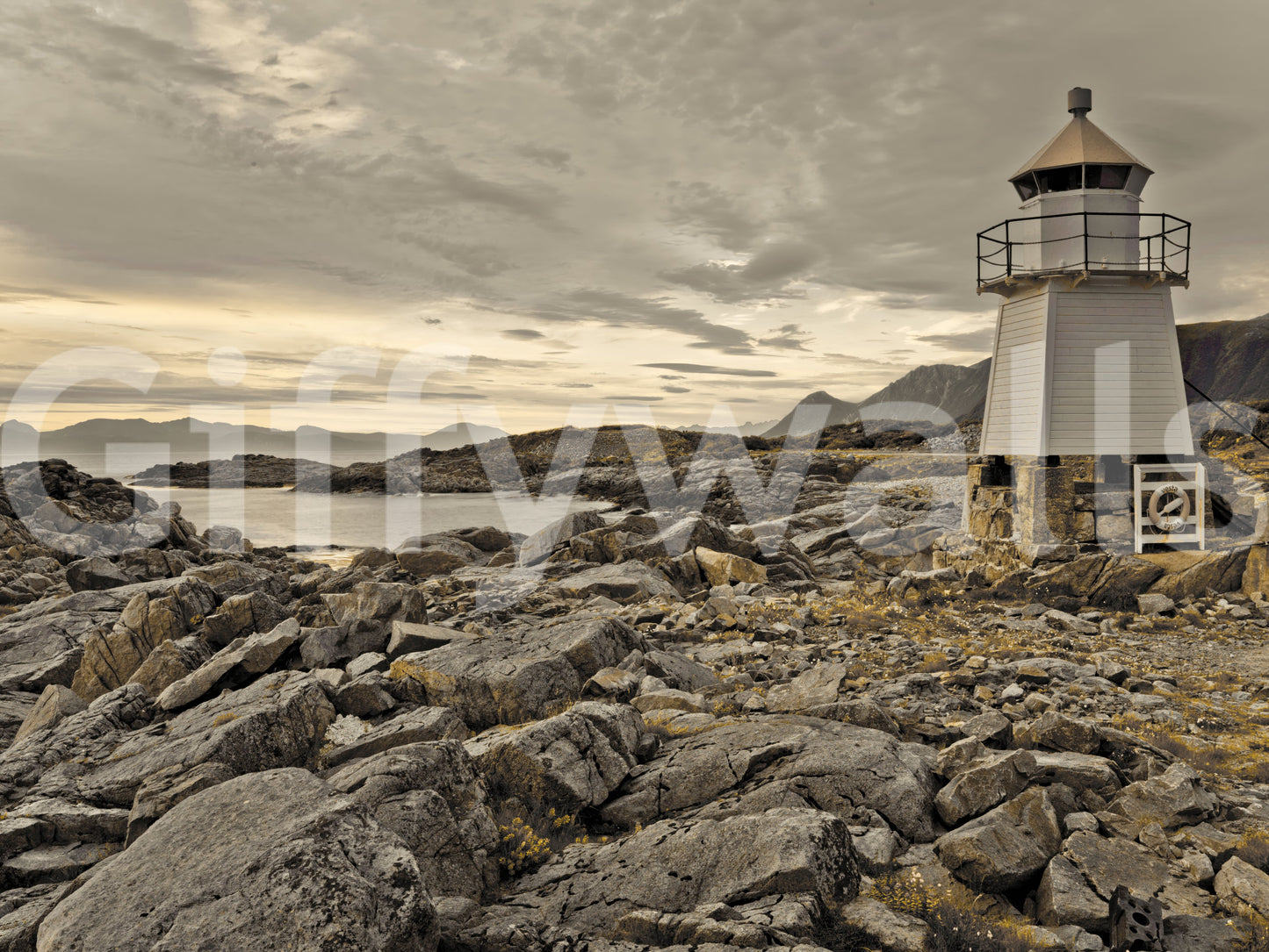 Oceanfront mural with a classic lighthouse set against a layered sky and rocky coastal backdrop.