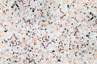 Vibrant Light Coral Terrazzo mural surface abstract composition playful stone particles.