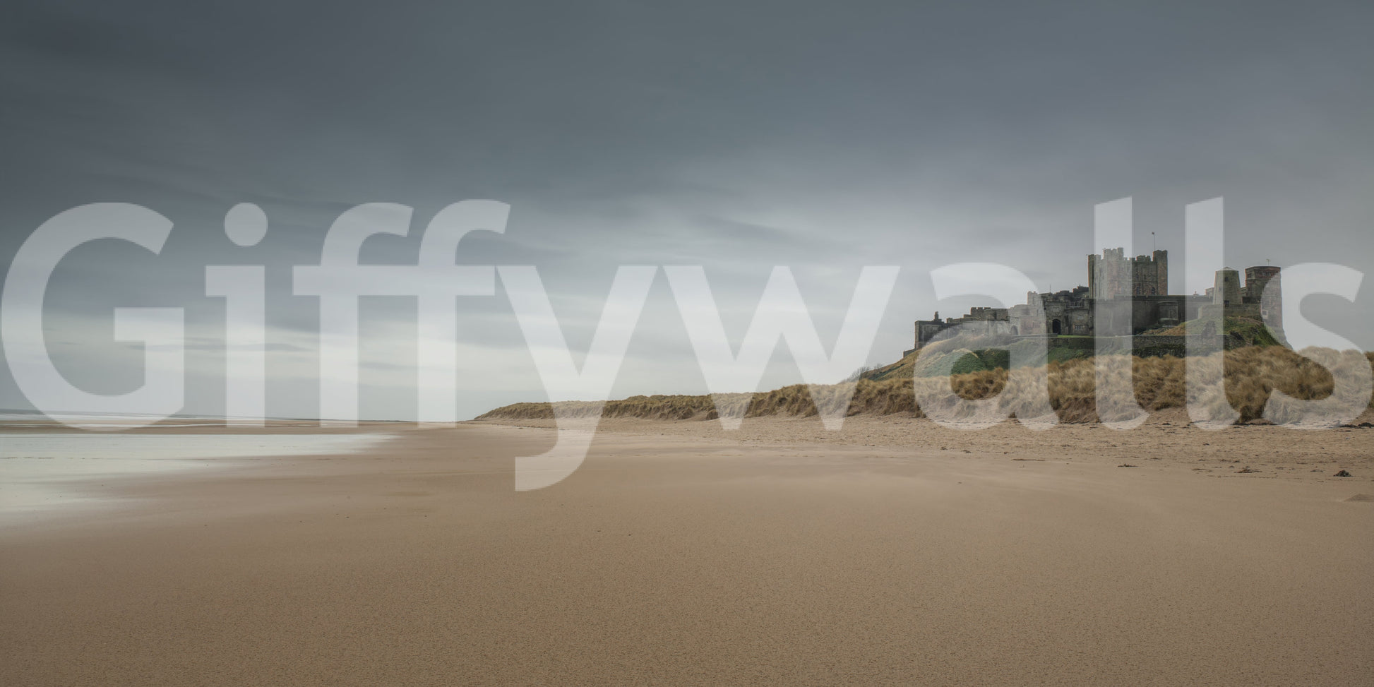 Old stone Bamburgh Castle stronghold wall display