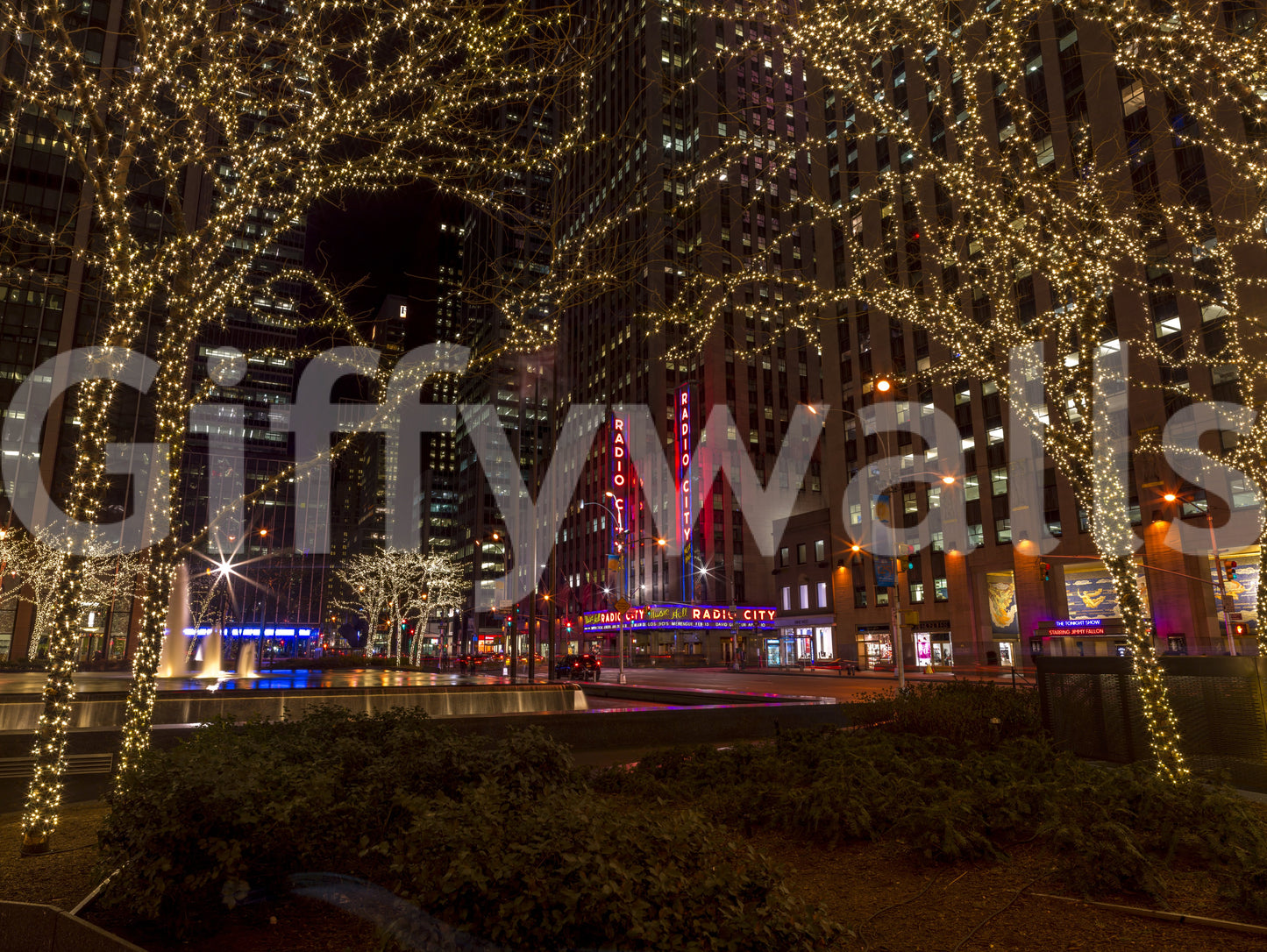 Dim evening hours drift through the Radio City Night Glow wall mural