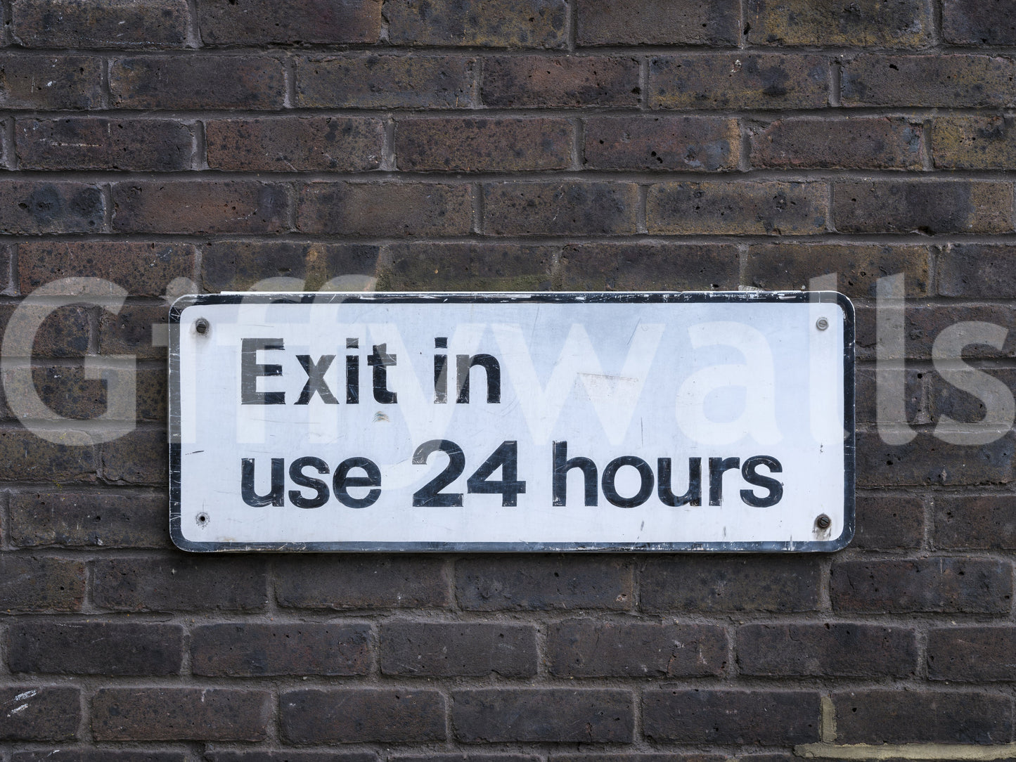 Weathered Exit on Textured Brick Wall Mural
