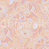Peach bloom wallpaper with soft swirl detailing and a calm pastel surface