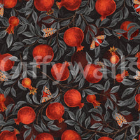Charcoal leaves crowd around fruit and moths in this Crimson Pomegranates wallpaper.