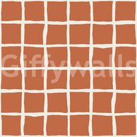 Earthy terracotta hues hold steady behind cream check lines on this wallpaper.