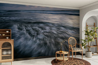 The wallpaper is used to create a feature wall in a dining room.

