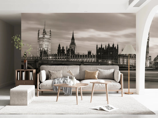 Westminster bridge wallpaper mural of Big Ben and Parliament in sepia behind a cream wooden-frame sofa in a living room