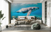 The design features a large, majestic whale swimming underwater.

