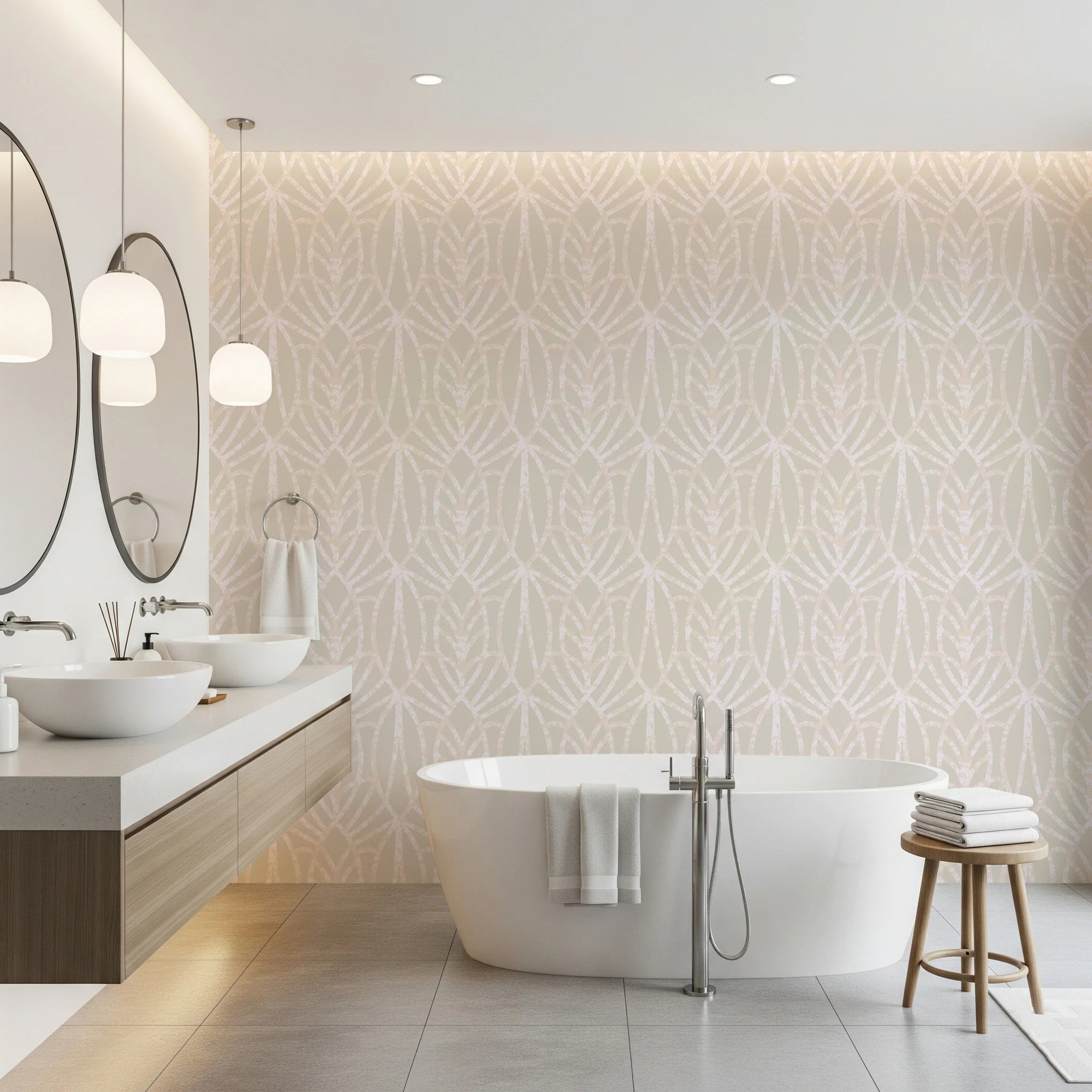 Whispered Arches wallpaper in soft beige with a pale Art Deco arch pattern behind a freestanding white tub in a bathroom