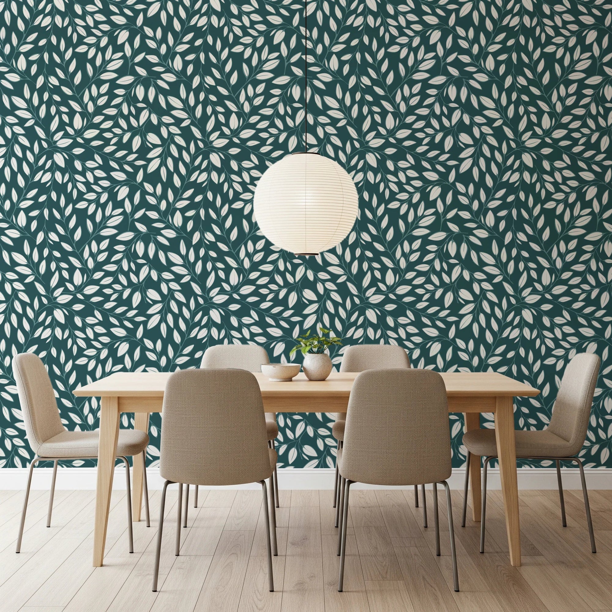 White Vines on Teal wallpaper behind a light wood dining table and beige chairs under a paper lantern pendant