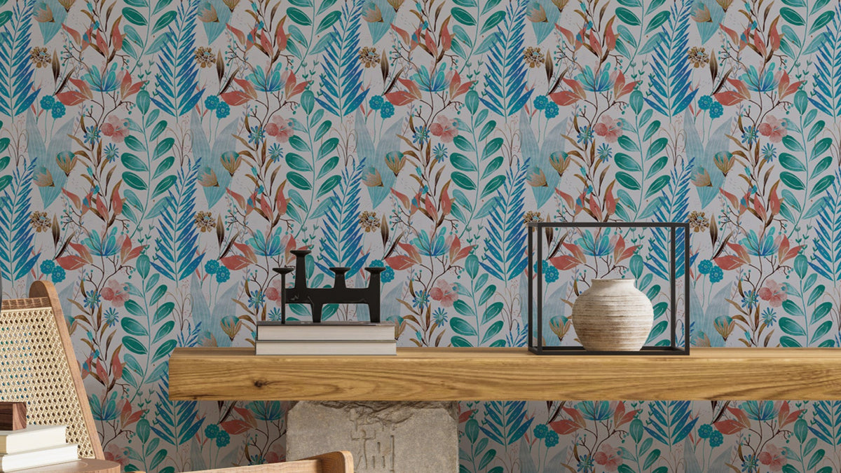 Wild Bloom Symphony Blue wallpaper in teal and coral florals behind a wooden console with books and vase