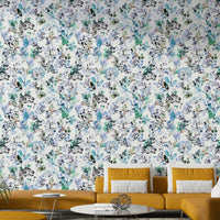 Wild Grasses Blue Wallpaper depicting a meadow in a contemporary home décor setting.