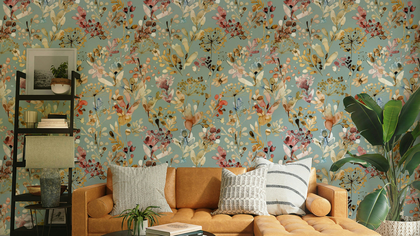 Moody teal wall decor with metallic gold botanical patterns for a primary bedroom.