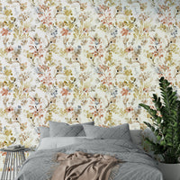 Nature inspired wall mural featuring gold plant silhouettes in a contemporary home office.