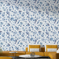 Botanical nature themed home décor in a master bedroom with soft white textiles.