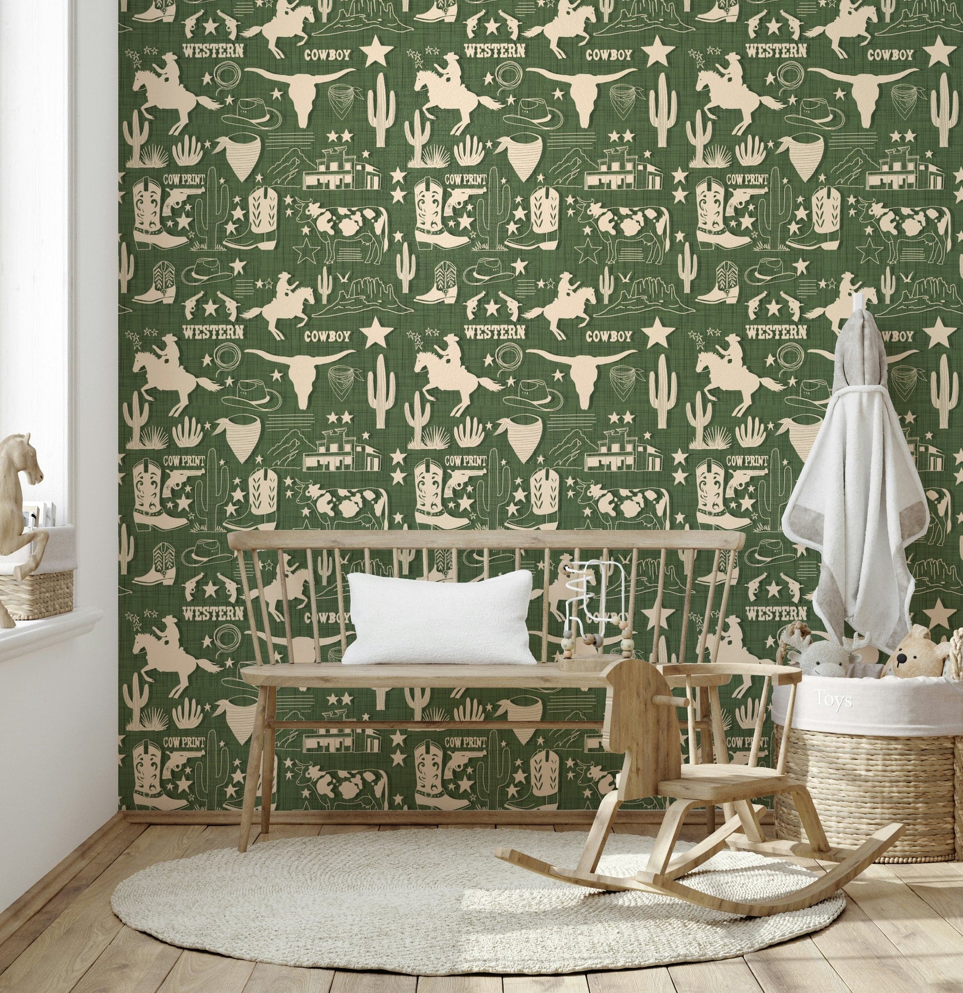 Wild West Sketch wallpaper featuring hand-drawn cowboy motifs, longhorns, and cacti on a textured green background.