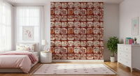 Patterned wallpaper featuring hand-sketched Alaska-themed patches of campers, backpacks, and animals.