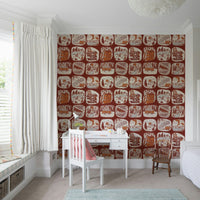 Rustic wallpaper mural showcasing hand-drawn wilderness patches in warm brown and cream tones.