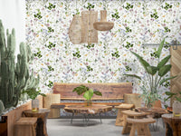 Home office setup featuring a floral meadow wall mural and ergonomic chair.