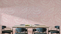 A wallpaper featuring a classic, intricate floral pattern.

