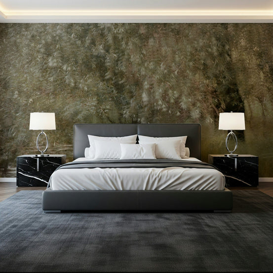 Willow Whispers wallpaper mural of a soft green weeping willow above a grey leather bed with black marble nightstands