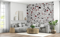 An artistic contemporary speckled mural on minimalist wallpaper.