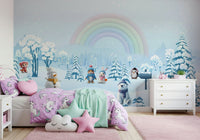 Toddler play space with winter rainbow mural wallpaper.