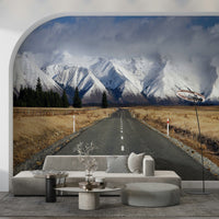 Winter road wall mural in modern living room, snowy trees, cool color tones, feature wall decor