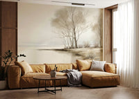 Delicate bare trees standing by a calm winter shore in a peaceful nature wallpaper.