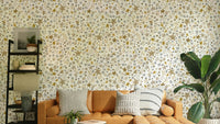 Winter Stars Gold Kids Wallpaper in a stylish flat nursery with wicker storage.