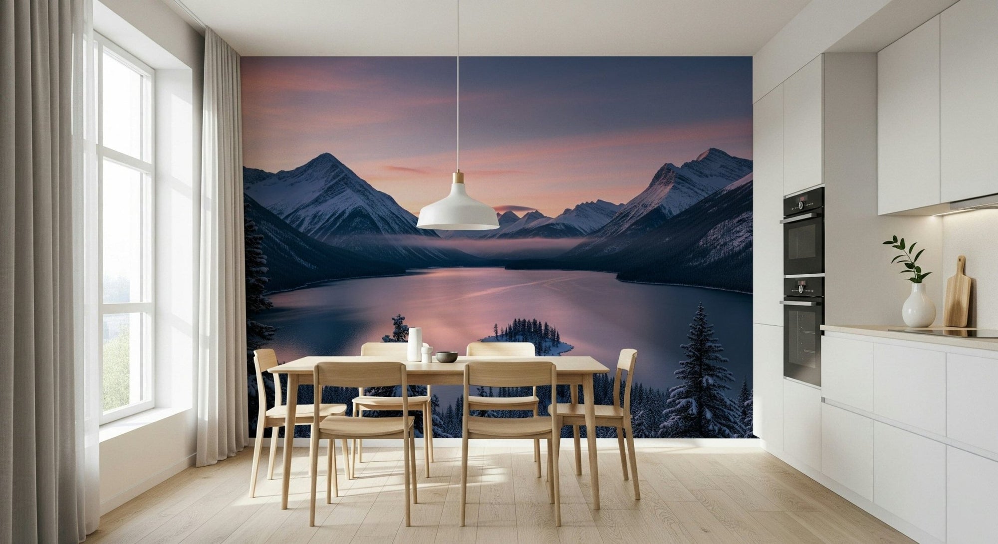 Winter's Calm wallpaper mural of a pink sunset over snowy mountains and a lake behind a light wood dining table in a white kitchen