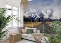 Snowy road wallpaper mural behind TV unit, modern living room feature wall with winter view