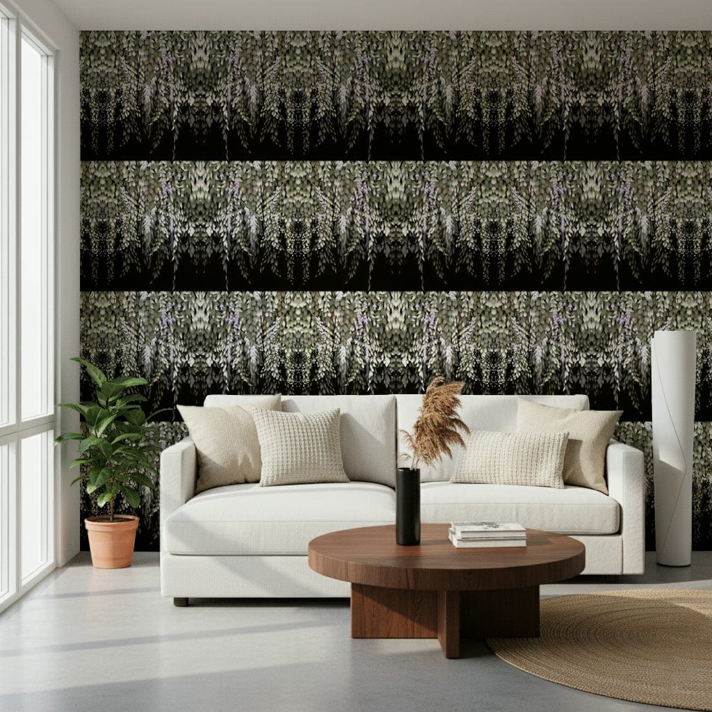 Wisteria Cascade wallpaper in sage and black behind a cream curved sofa in a bright living room