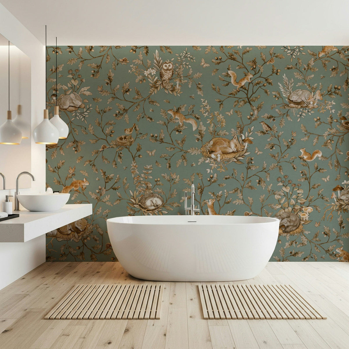 Woodland Dreams wallpaper mural in sage green in a bathroom with white oval tub and floating double vanity